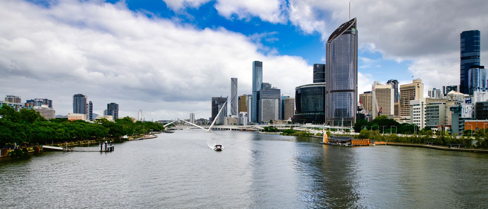 Brisbane River and city skyline under a blue sky