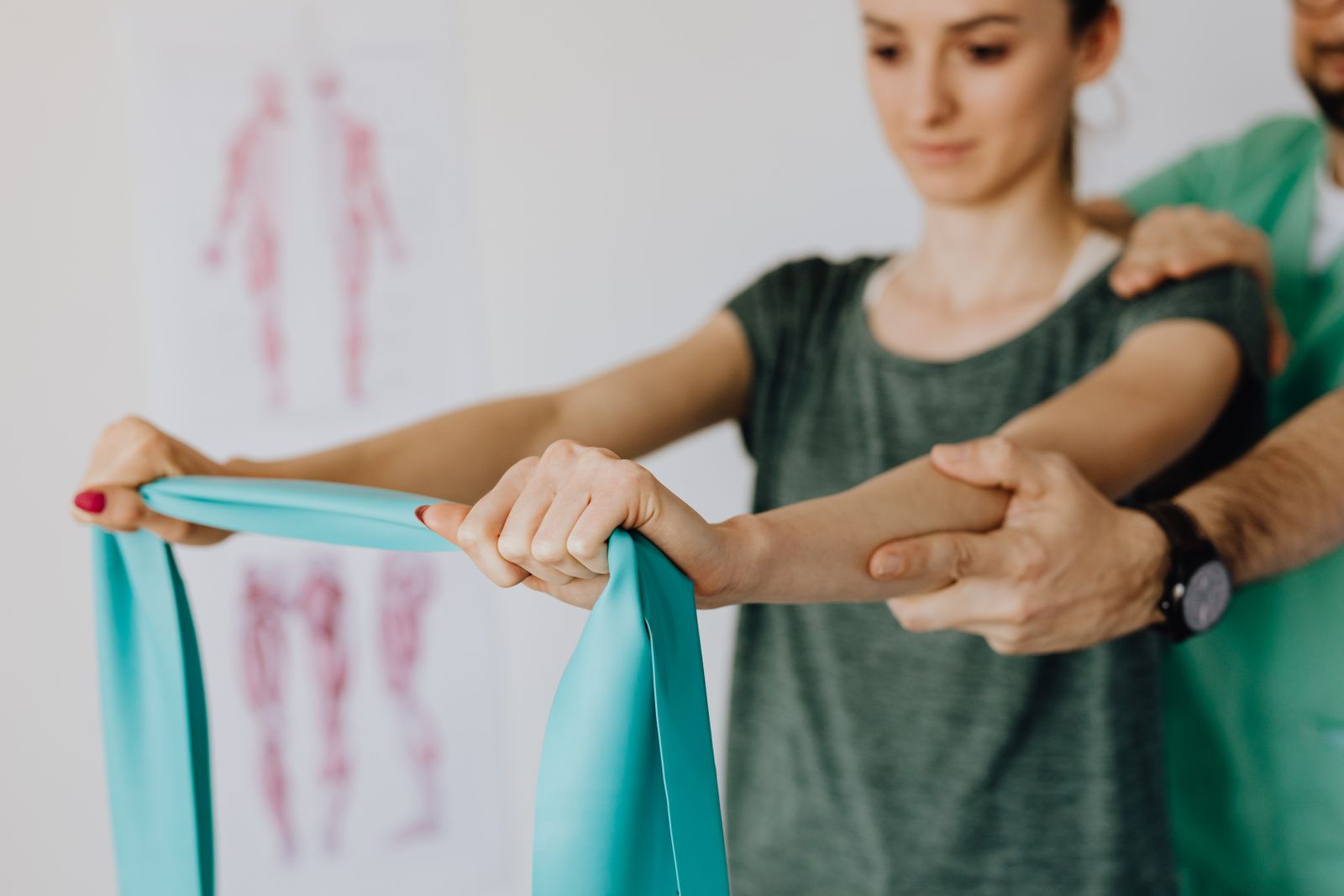 Clinician helping a patient with a rehabilitation exercise