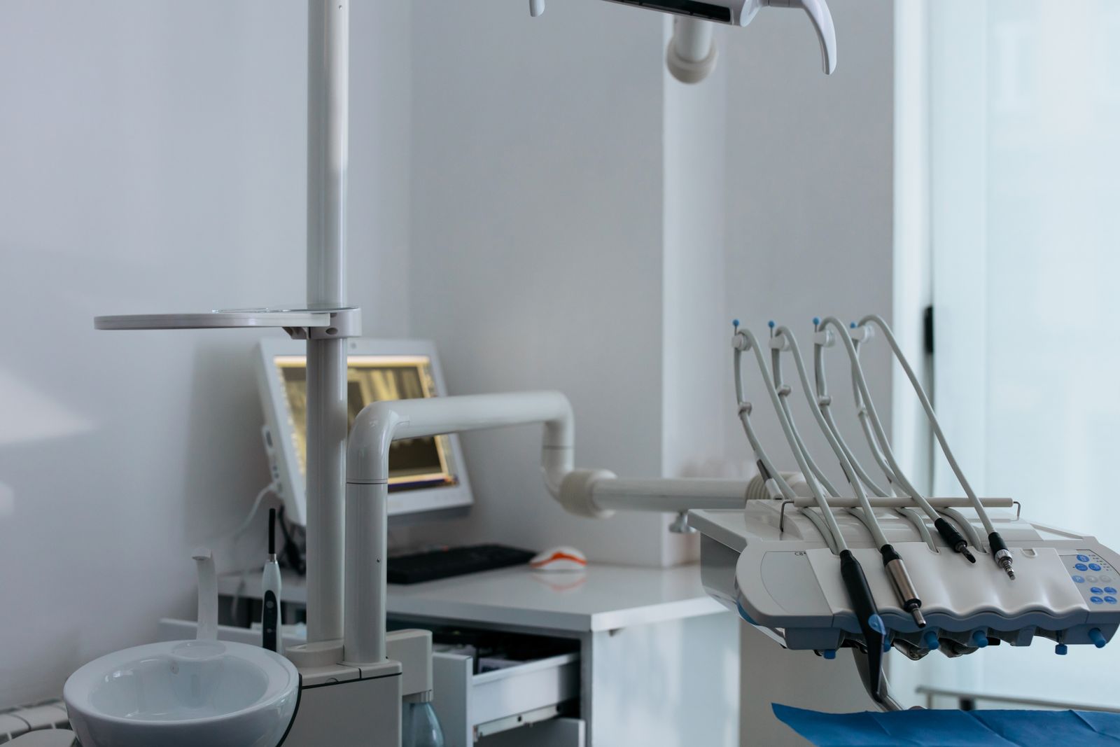 Dentist and patient smiling during a check-up