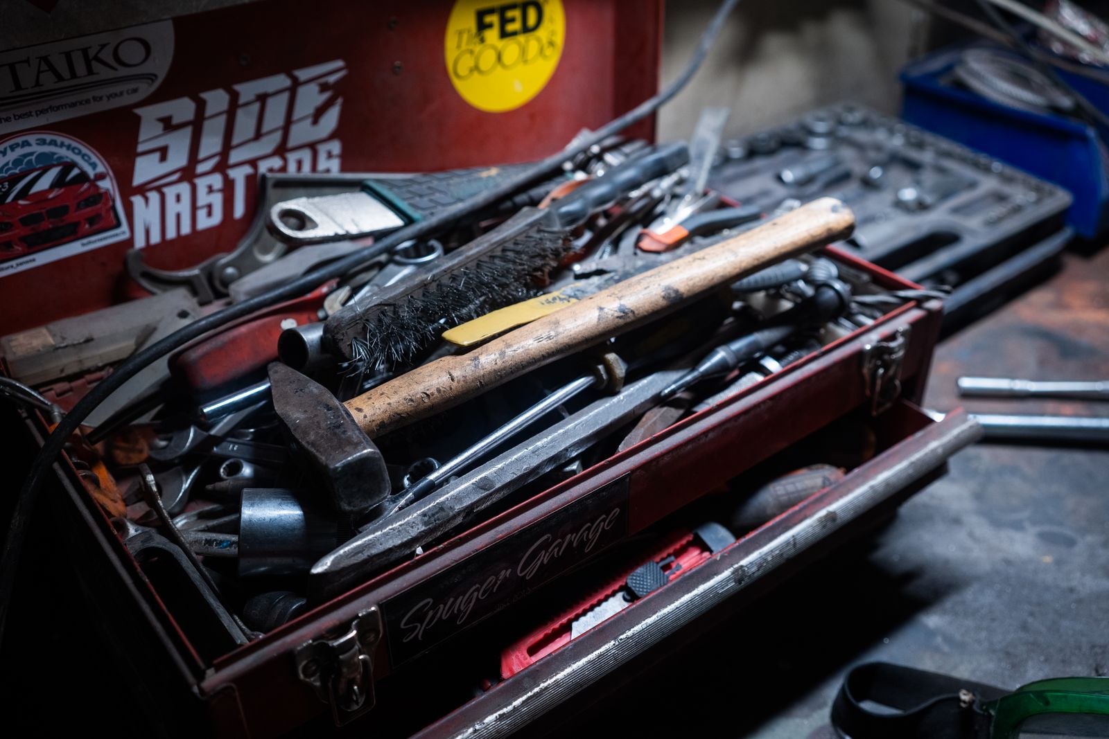 Toolbox full of hand tools in a workshop